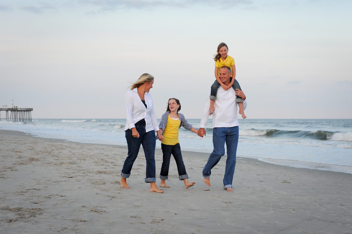 family walking on the beach