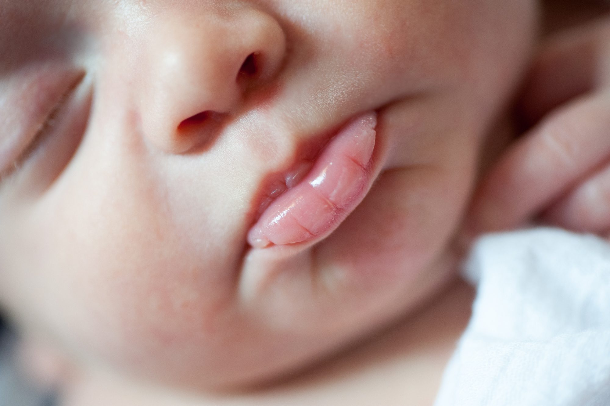 closeup of a newborns lips photographed during a Philadelphia in-home newborn photography session