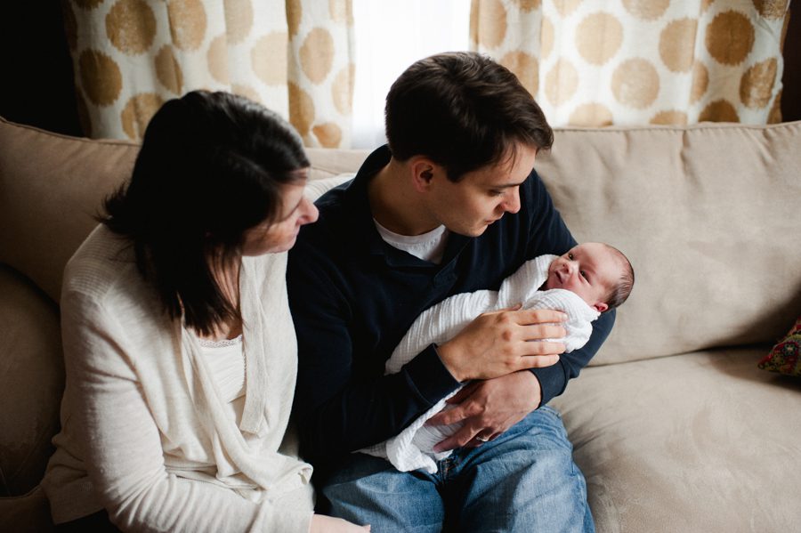 11-parents-holding-new-baby-at-home