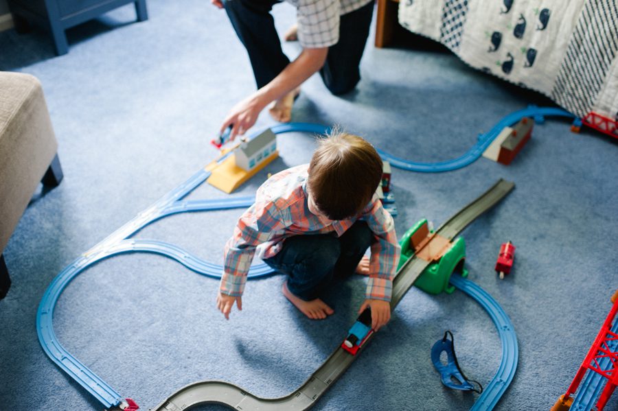 10-boy-playing-with-train-set