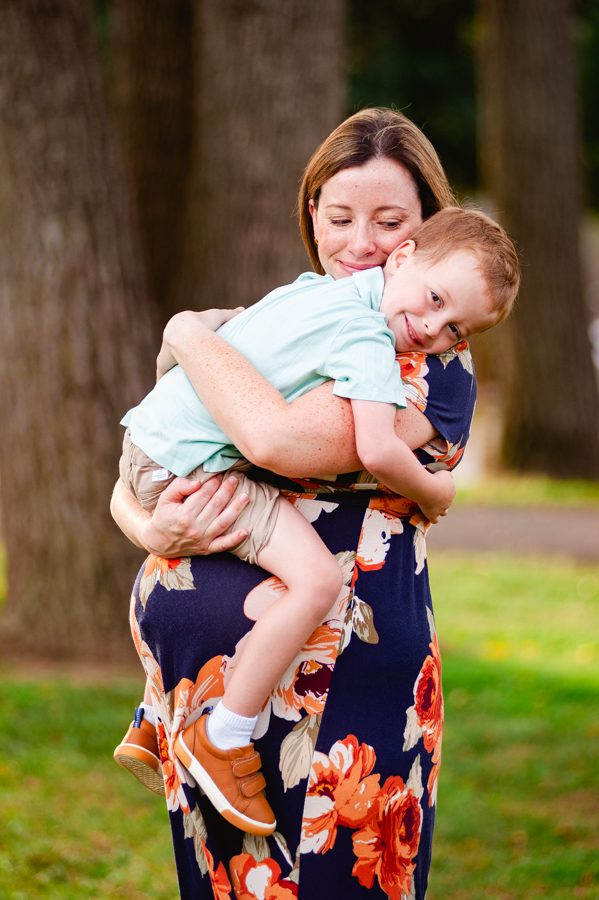 Expecting mother holds son